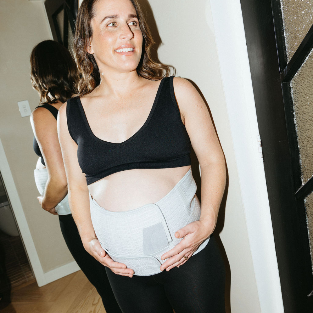 pregnant person wearing pregnancy support belt