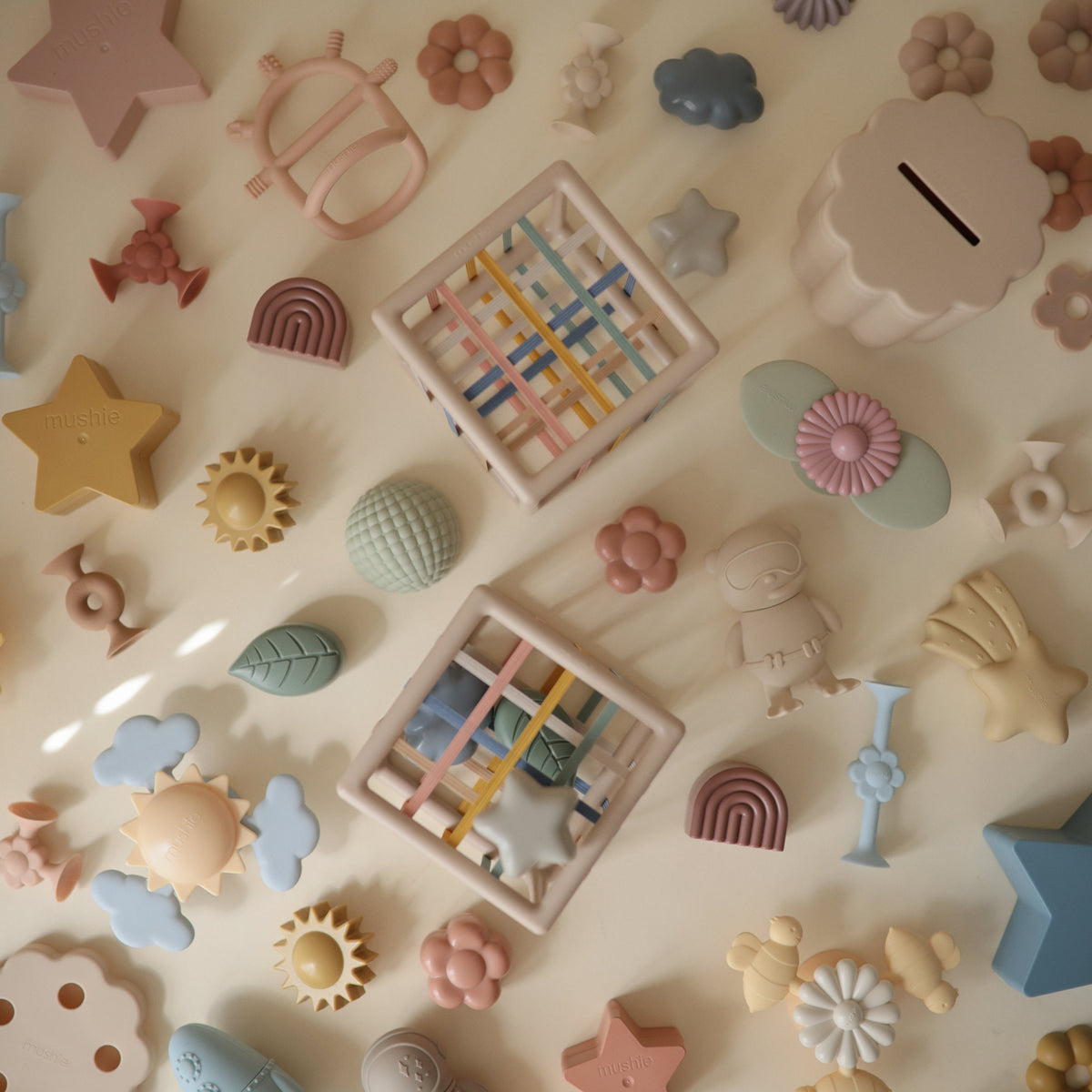 Mushie Elastic Shape Sorter and shapes