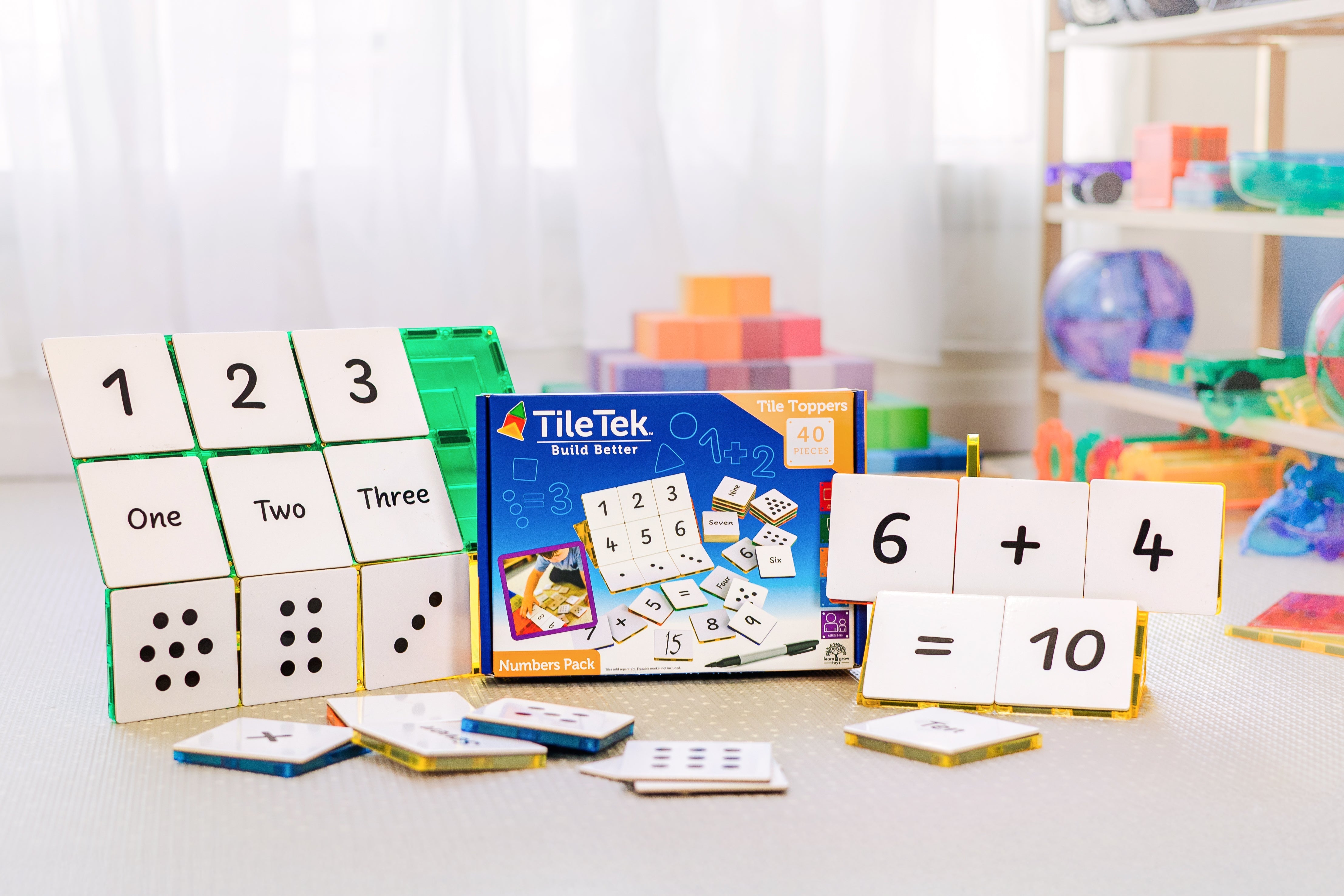 Child learning numbers with the Numbers Pack tile toppers
