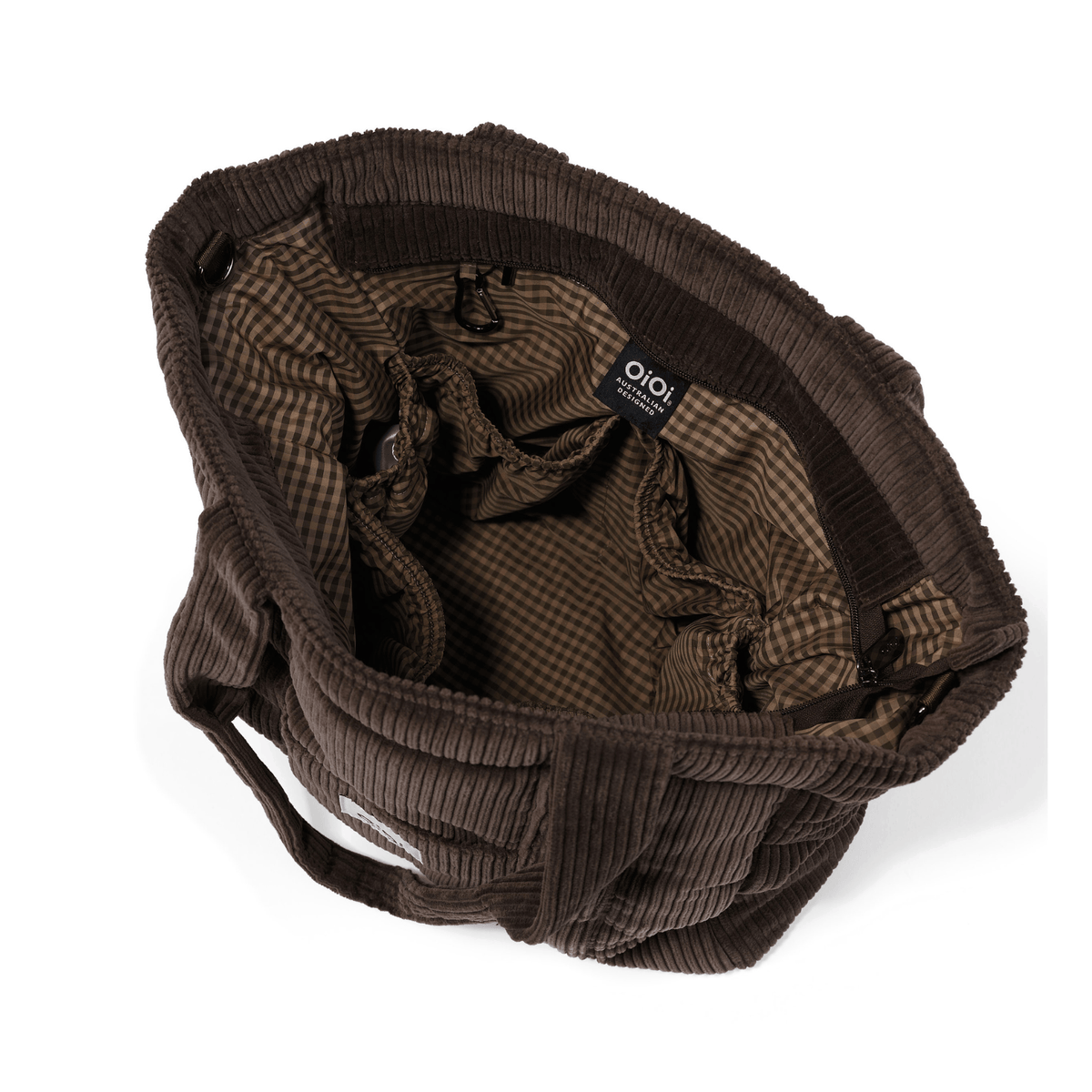 Interior of the OiOi Everyday Tote showing the water-resistant gingham lining and internal pockets