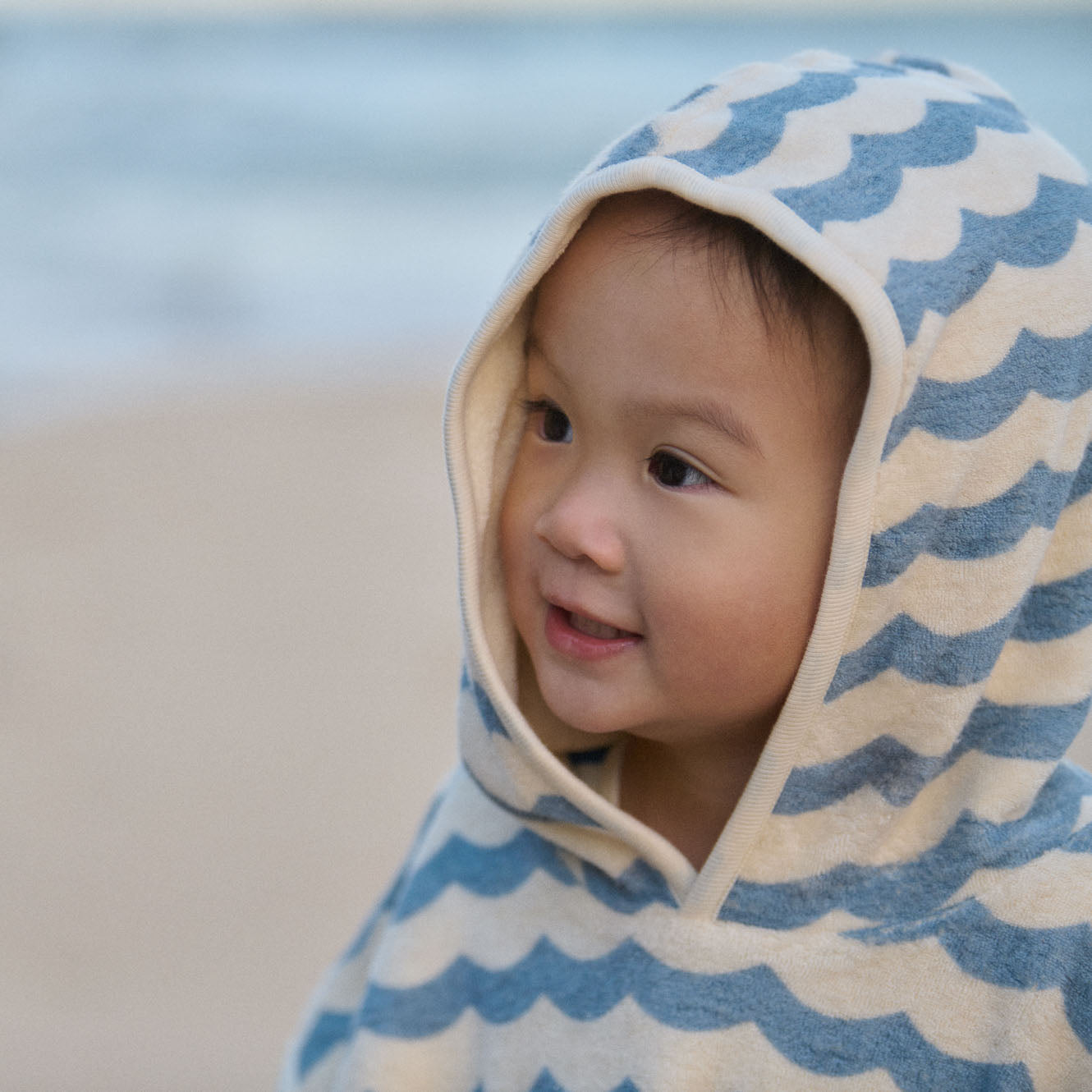 Poncho Towel in Waves Print, in use