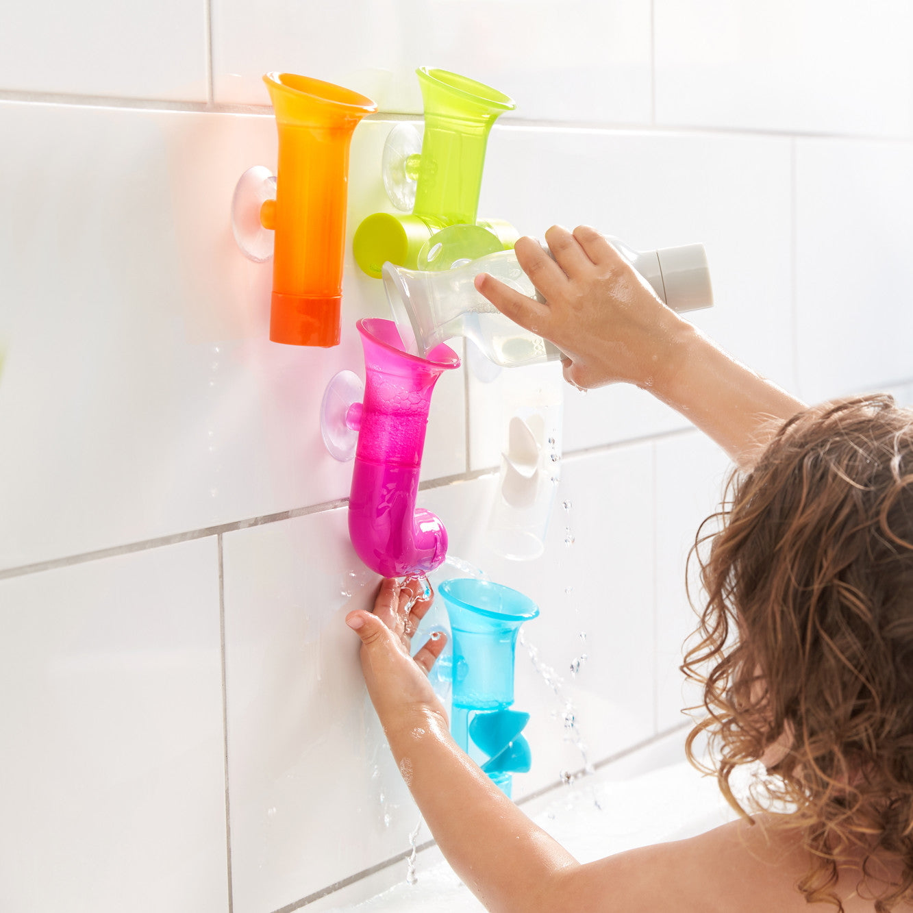 Boon Pipes Bright bath toys in use at bath time