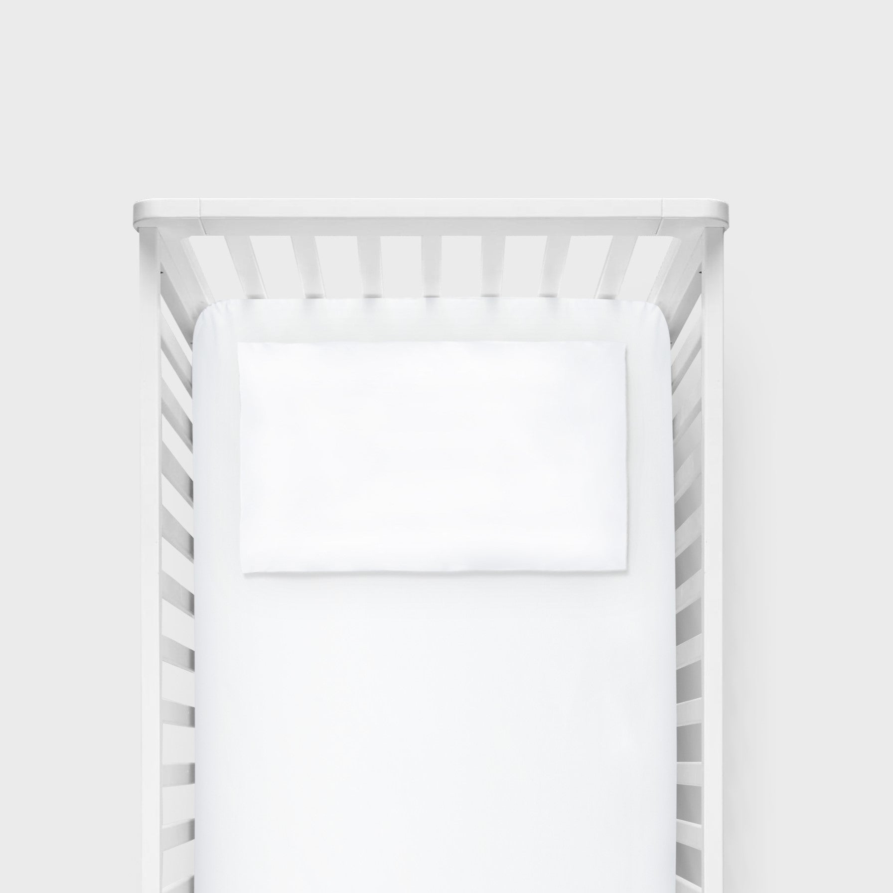 BabyRest Junior Bamboo Pillow Case styled on a child's bed in a nursery