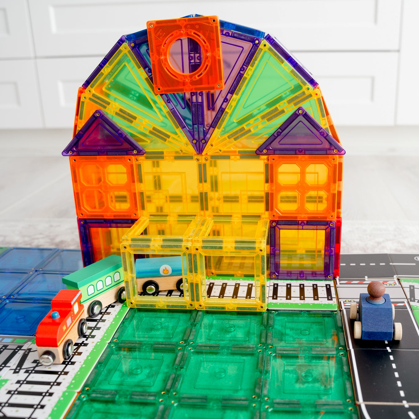 Colourful magnetic tile station built with Train and Road Pack toppers