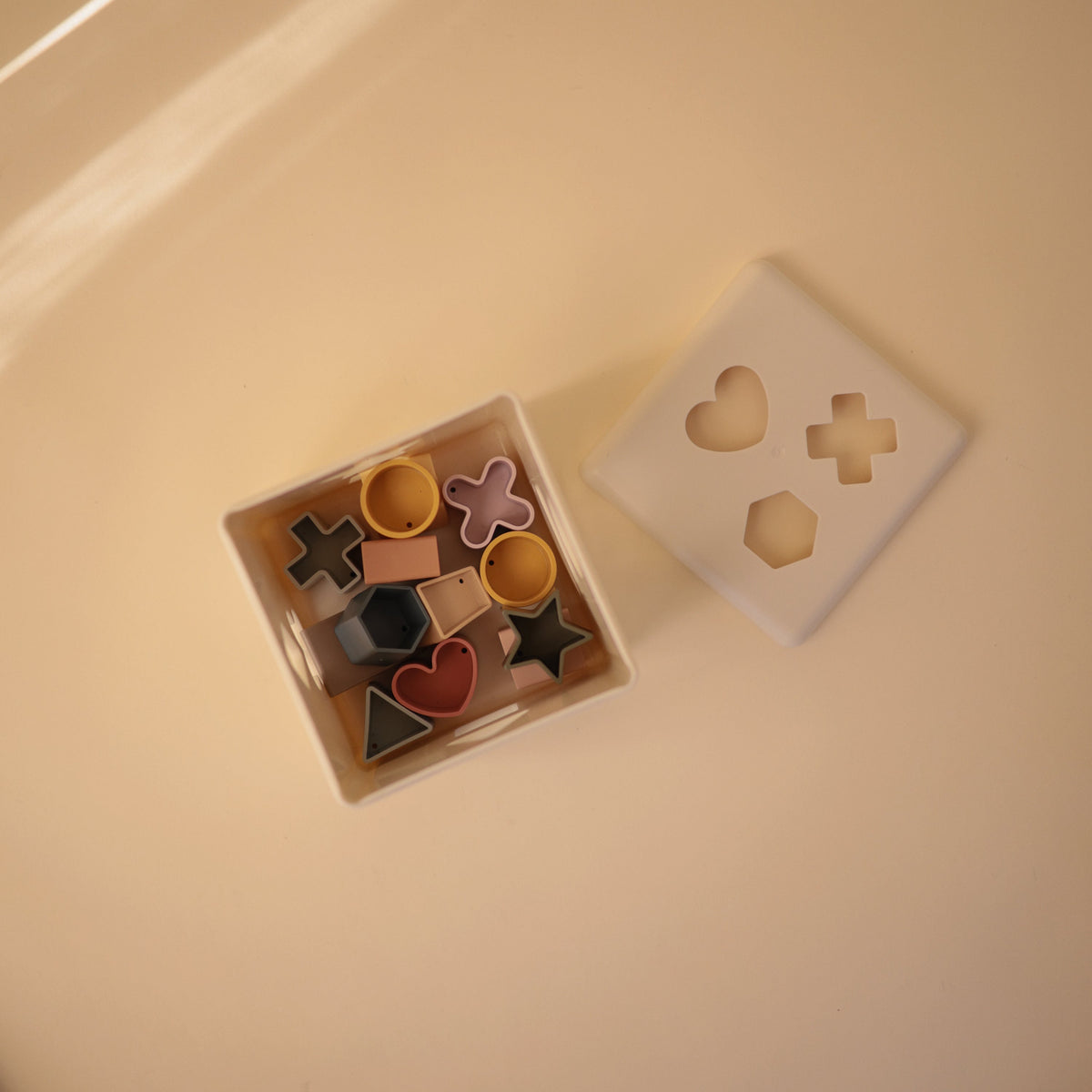 Mushie Shape Sorting Box with lid and shapes
