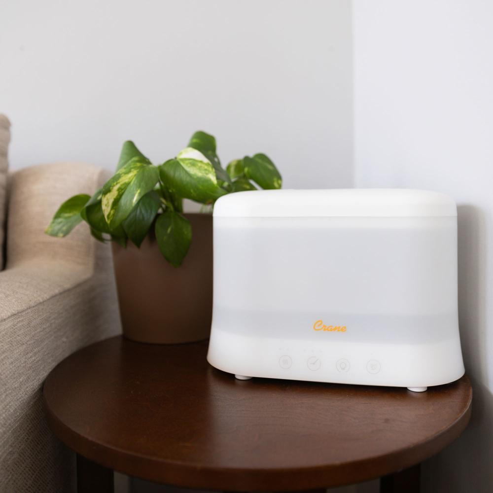 Crane Top Fill Humidifier misting in a nursery