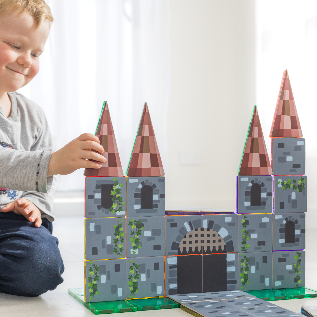 Magnetic tile castle built with the Castle Pack toppers