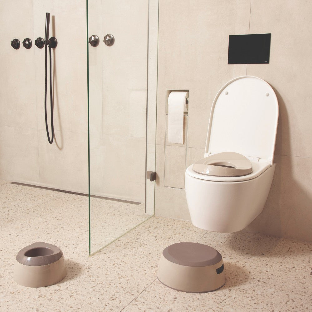 Luma Toilet Training Seat in Almond, fitted to a toilet