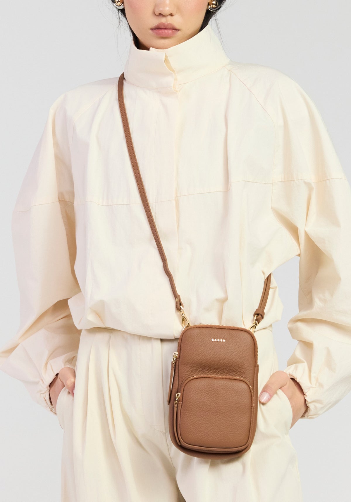 Saben Nikko phone sling tan worn crossbody