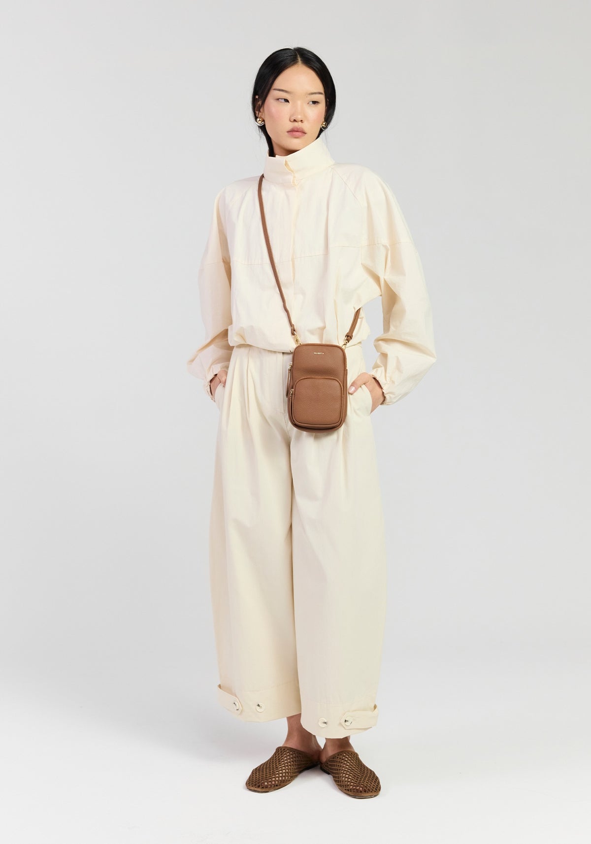 Saben Nikko phone sling tan worn hands-free
