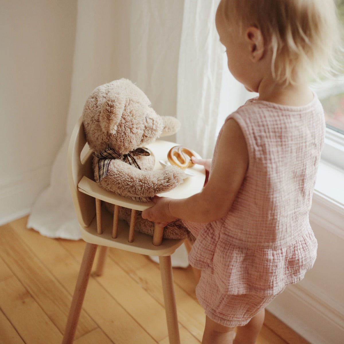 Toddler with the Kinderfeets Doll High Chair