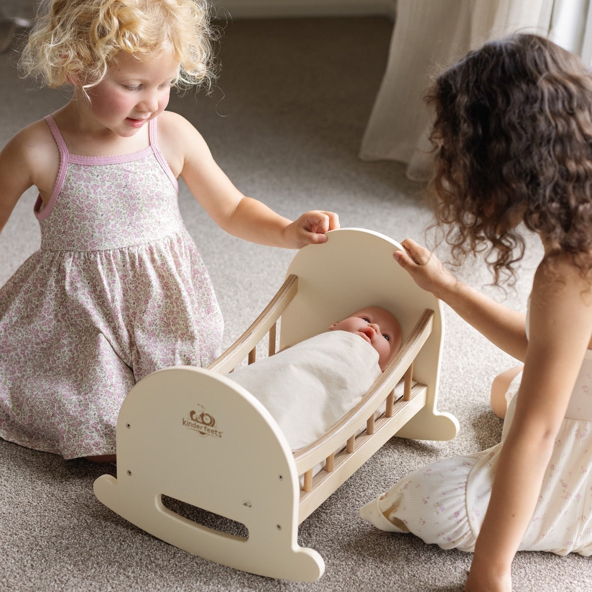 Children playing with the Kinderfeets Doll Crib