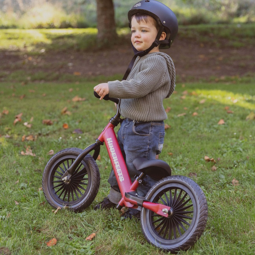 Kinderfeets Trail Bike Red on the grass