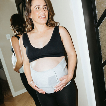 pregnant person wearing pregnancy support belt