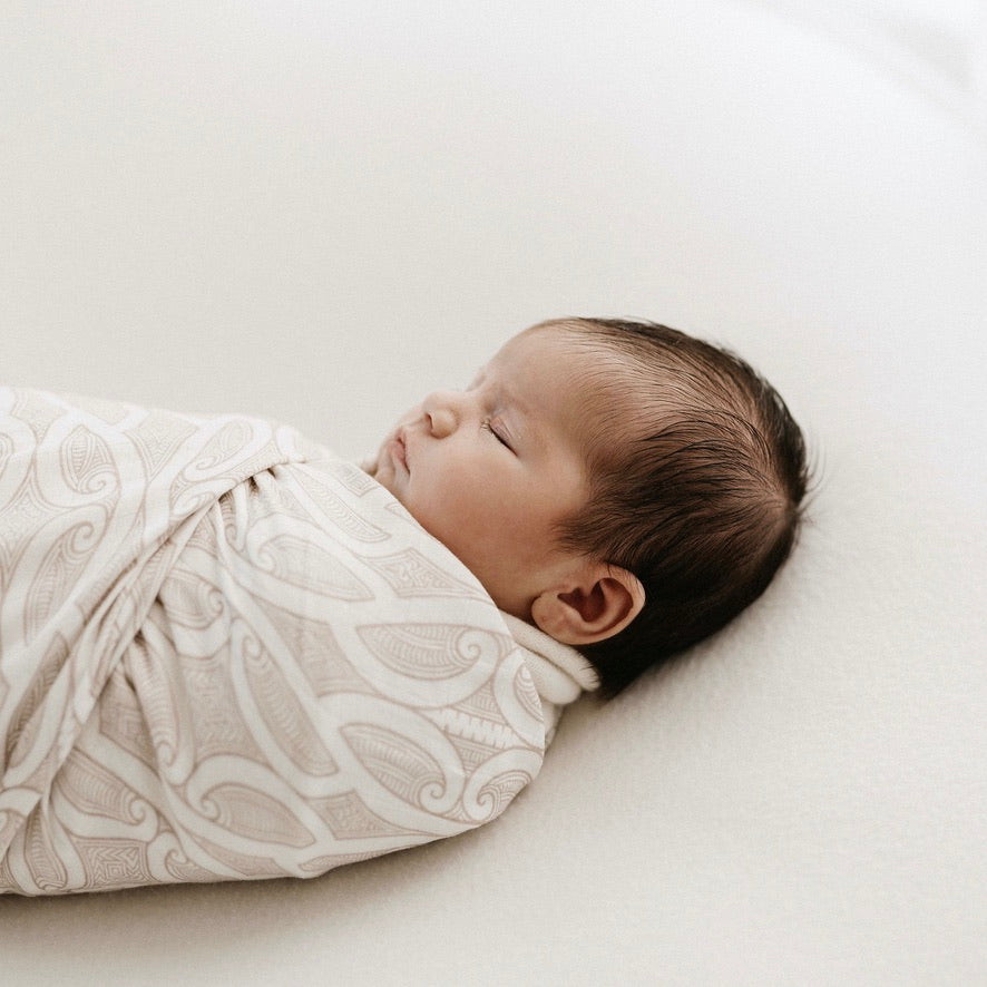 Newborn swaddled in the Te Patiki Pepi Wrap in Mocha