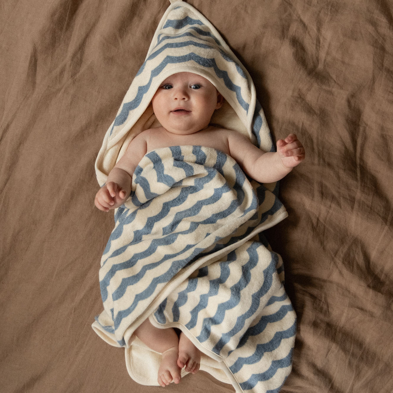 Hooded Towel in Waves Print, in use