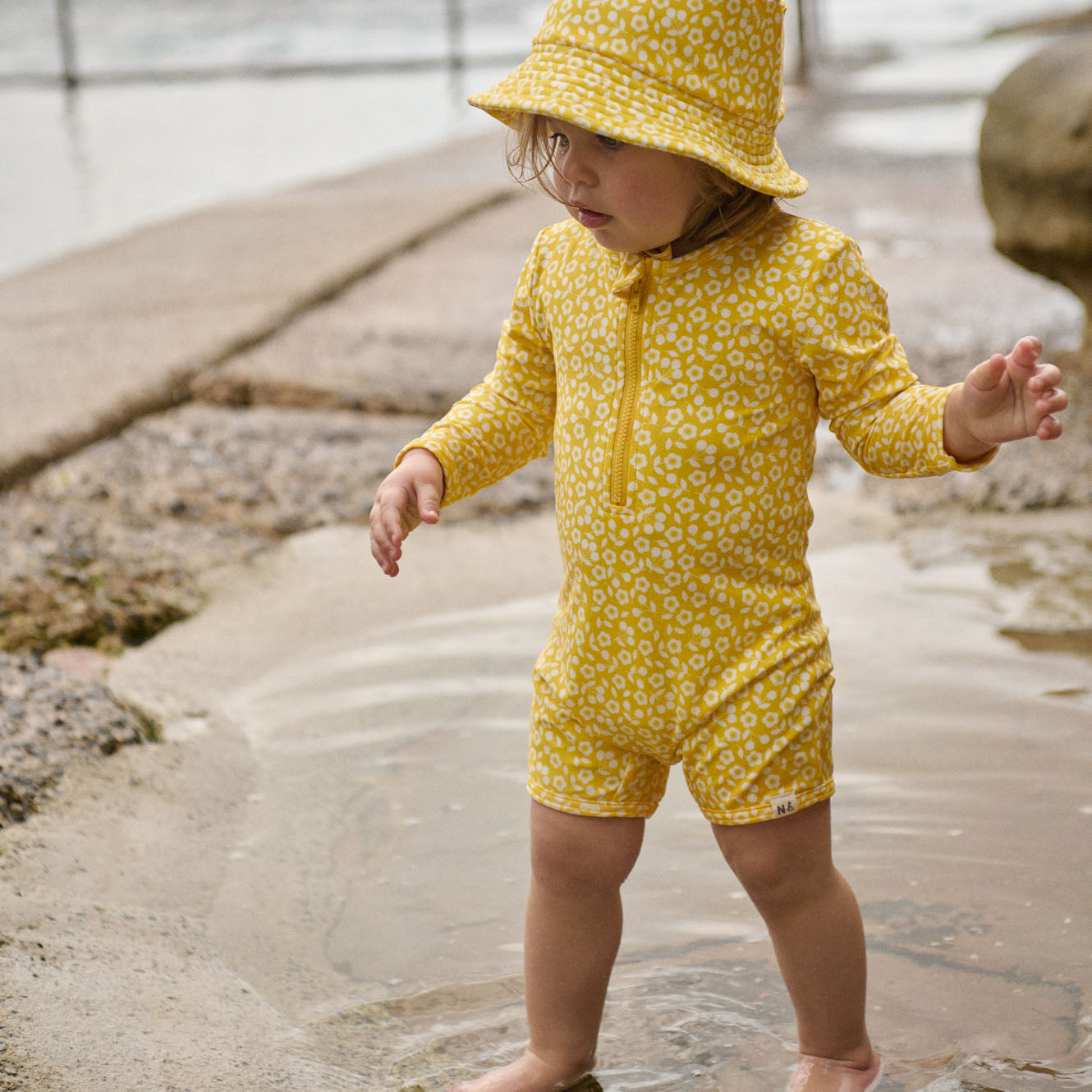 One Piece Bathing Trunks in Kitchen Garden Freesia Print, worn