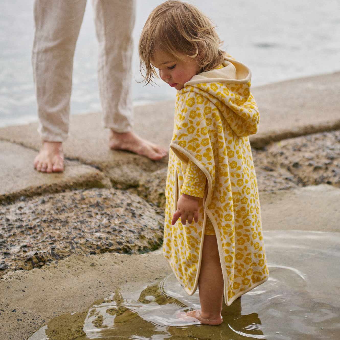 Poncho Towel in Kitchen Garden Freesia Print, in use