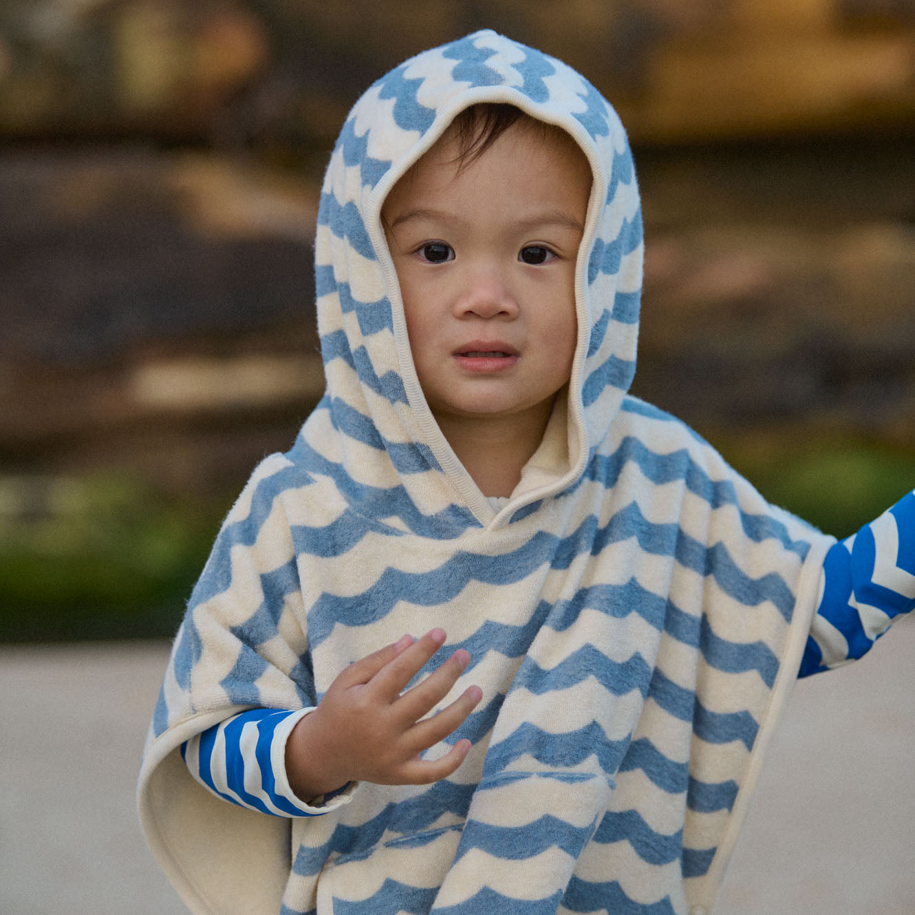 Poncho Towel in Waves Print, in use