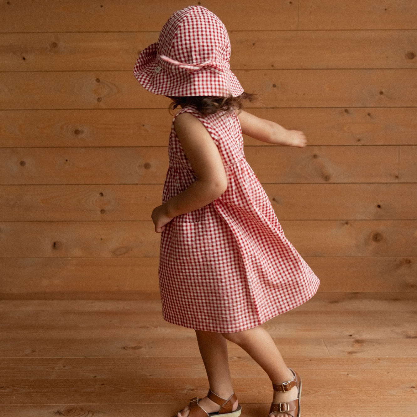 Sunhat in Red Gingham, worn