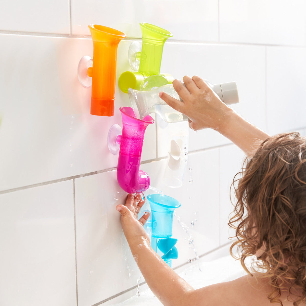 Boon Pipes Bright bath toys in use at bath time