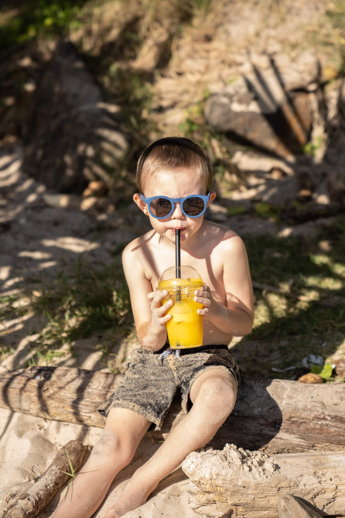 Child wearing Frankie Ray ECO Kids Sunglasses in Ocean Blue