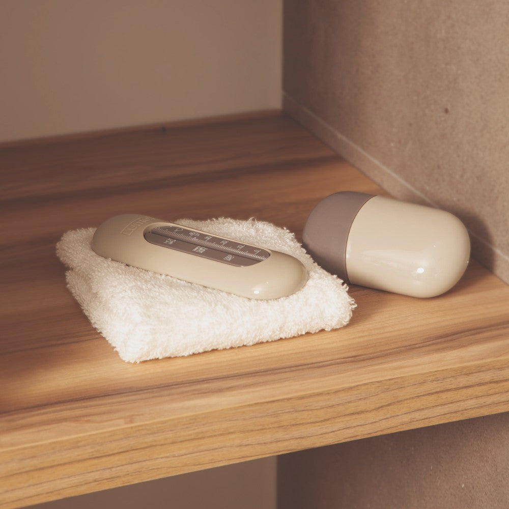 Luma Bath Thermometer in Almond, in the bath