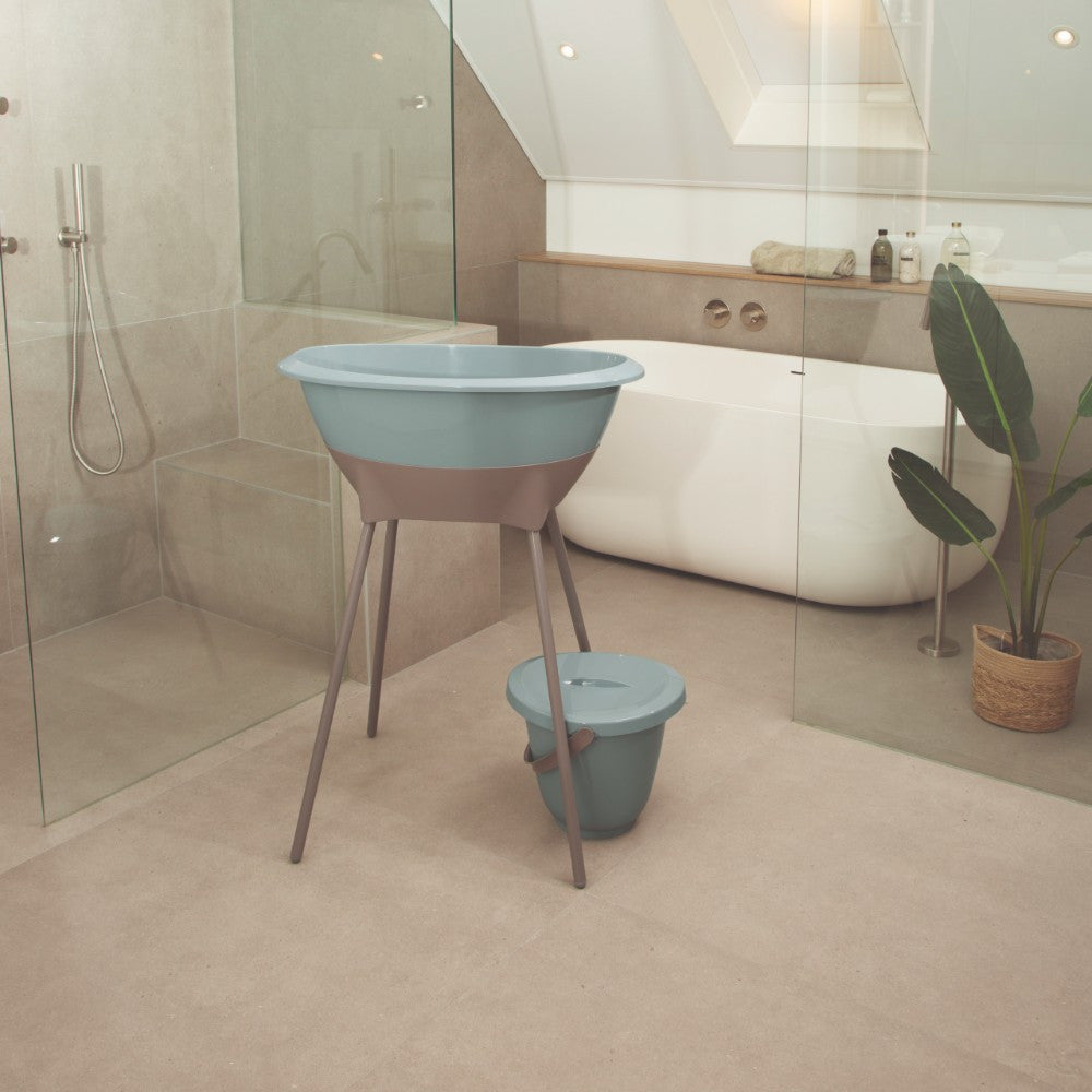 Luma Baby Bath Stand in Chalk Brown, side view