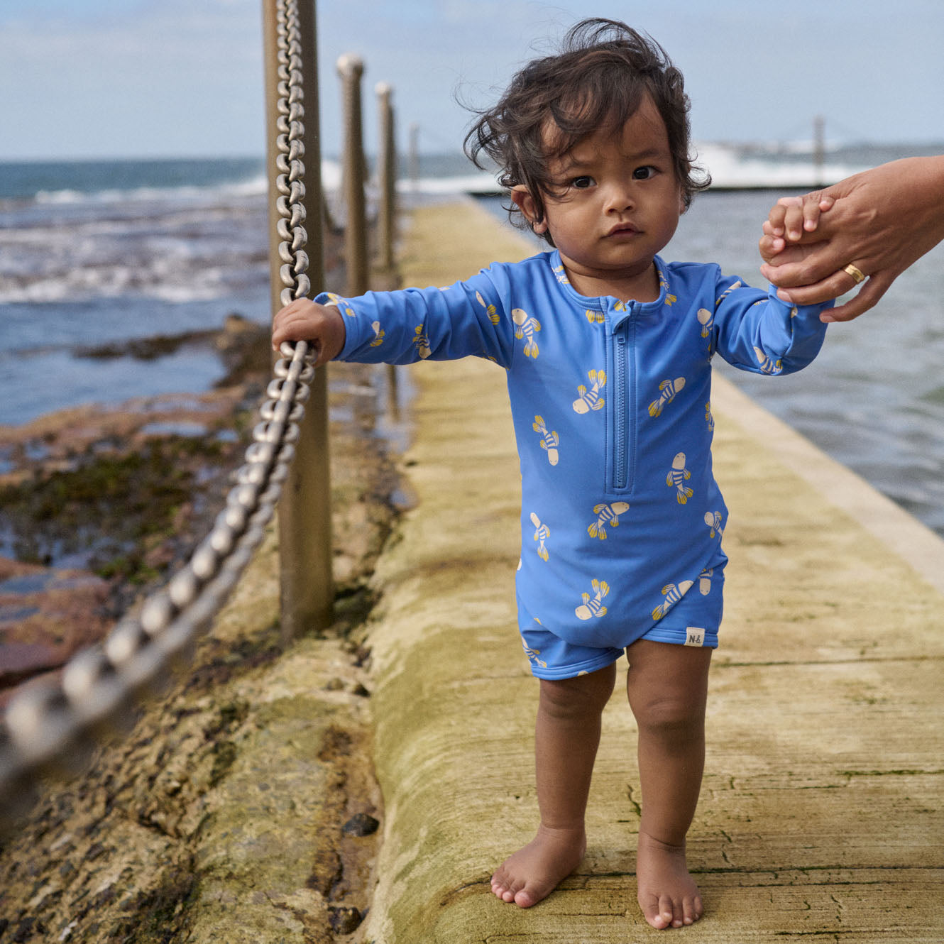 One Piece Bathing Trunks in Fish Fable Blue Print worn by child
