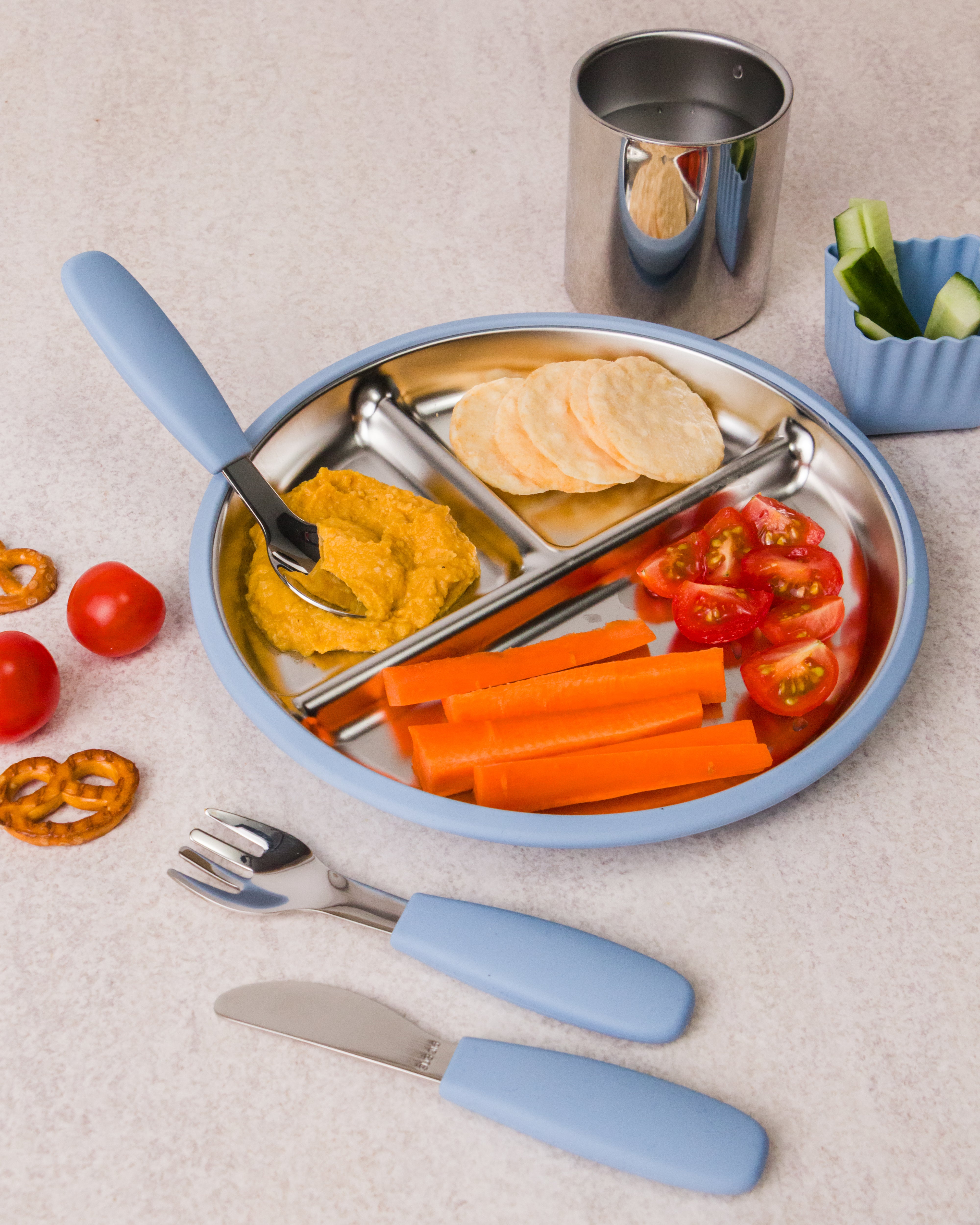 nestling stainless steel dinnerware in dusty blue