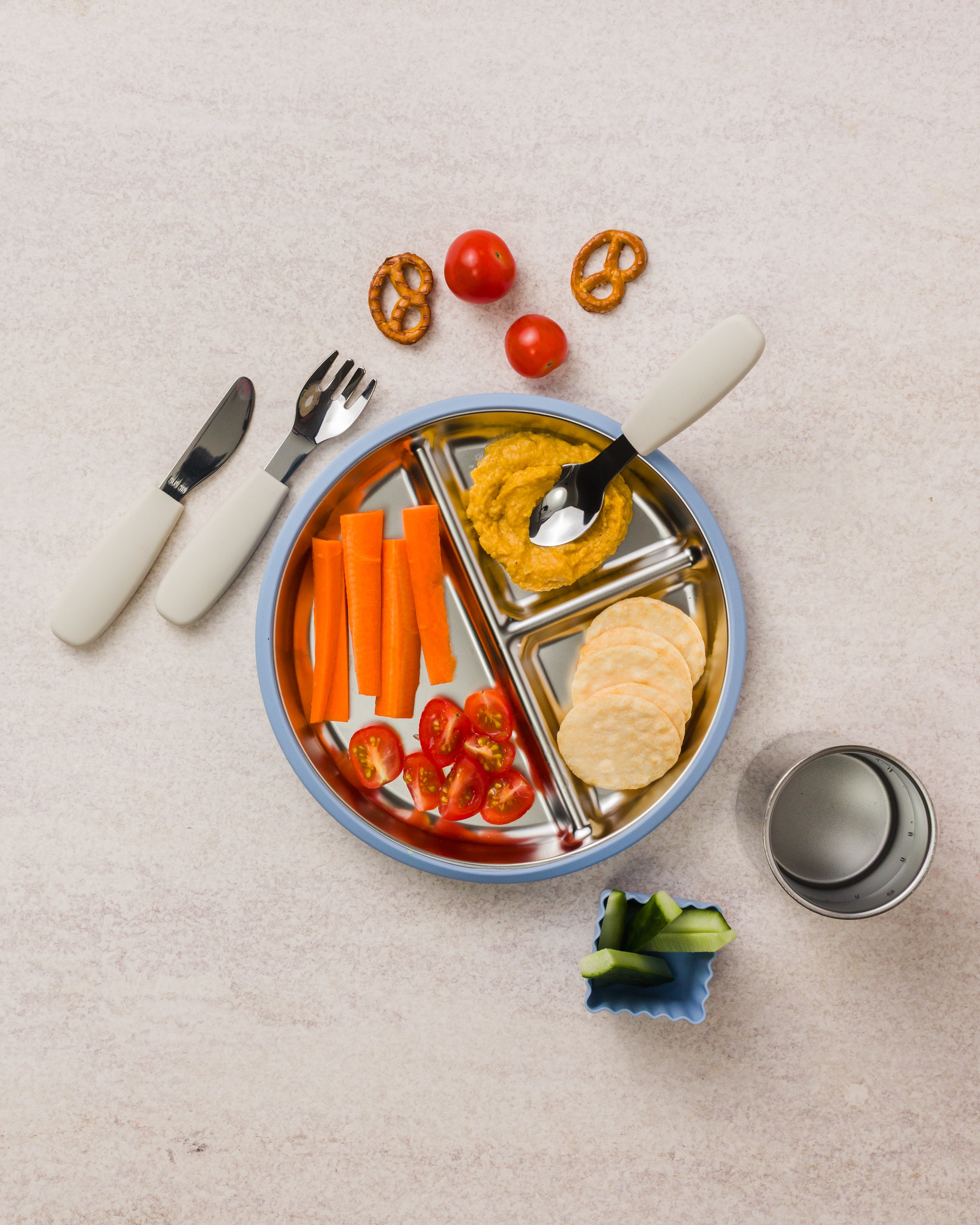 nestling stainless steel dinnerware in dusty blue
