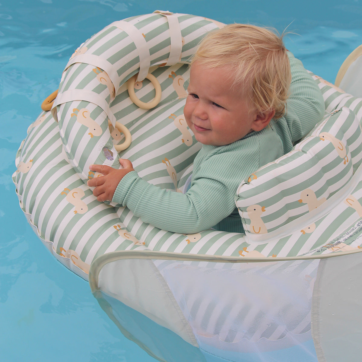 Sunnylife Interactive Baby Float with canopy up in the pool