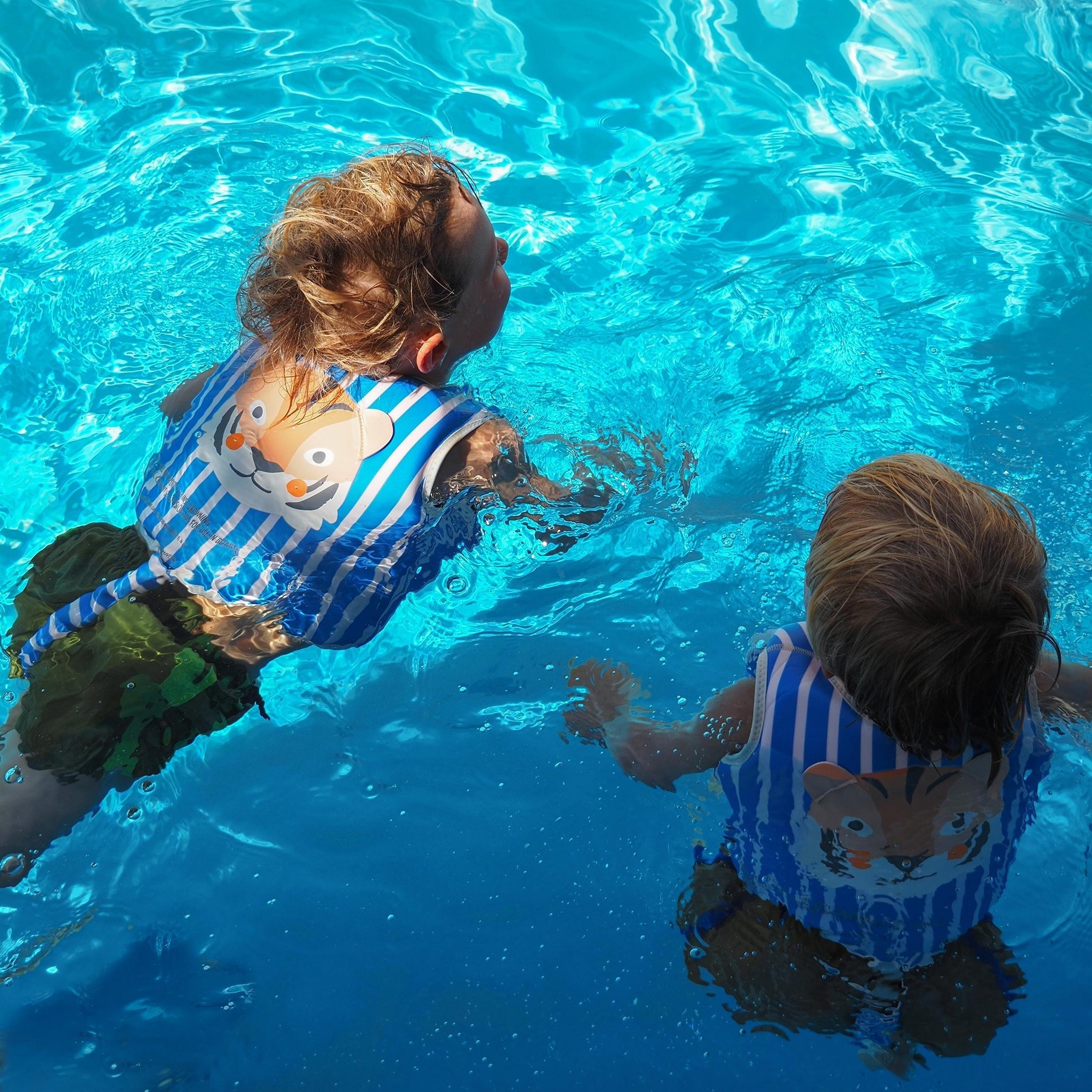 Kids Swim Vest Tino the Tiger Blue at the pool