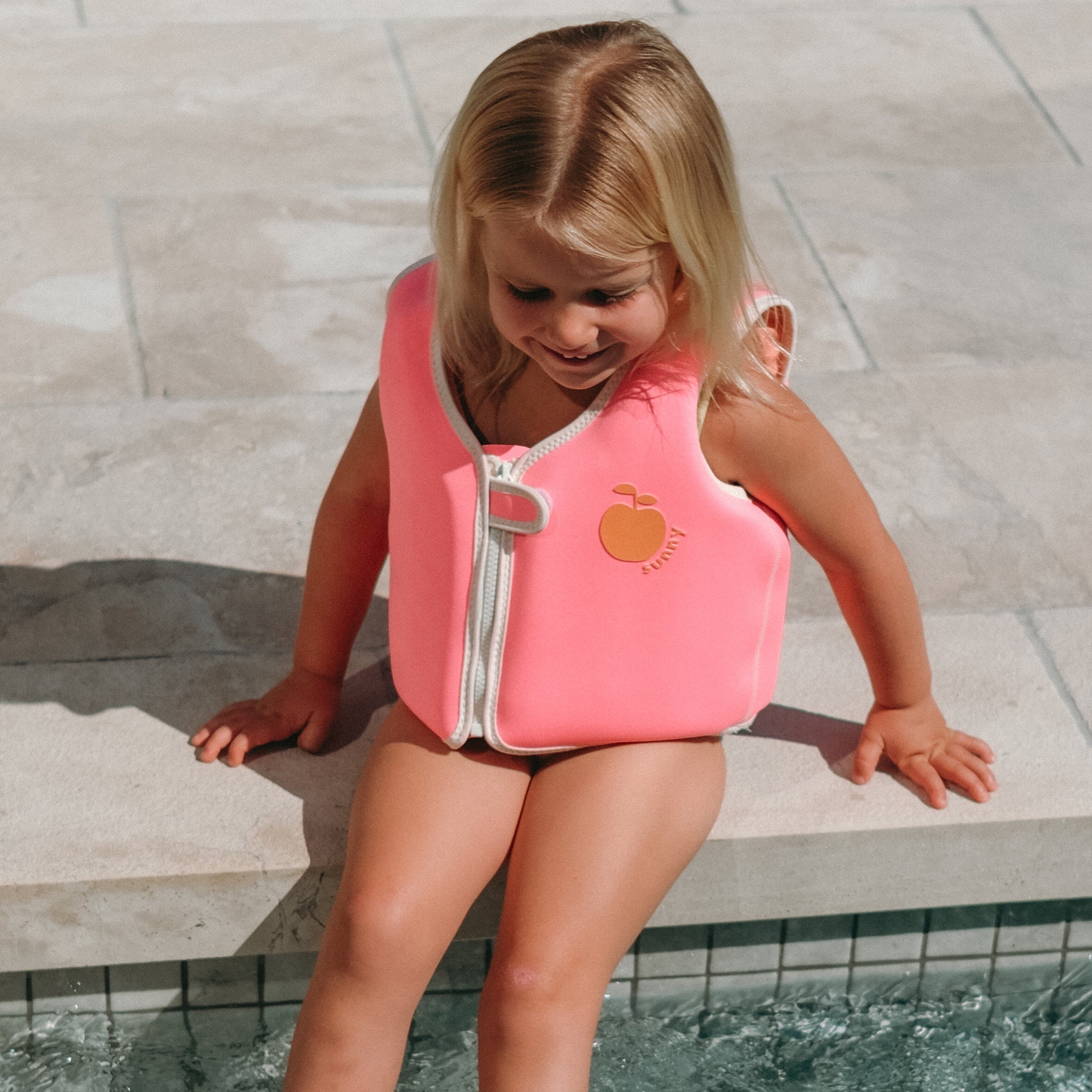 Kids Swim Vest Poppy the Peach Neon Pink at the pool