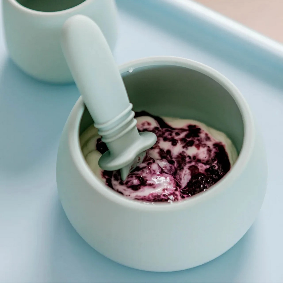 Starting Solids Australia Selfie Spoon scooping purée from a silicone bowl