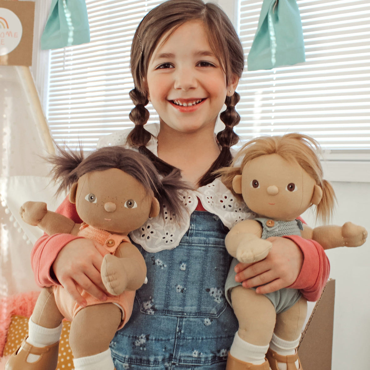 Dinkum Doll Dottie held by a child