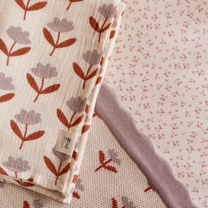 nature baby fleurette muslin swaddle and fitted jersey sheet in dandelion