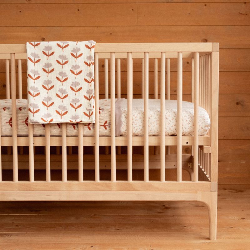 nature baby fitted jersey sheet in dandelion and muslin swaddle in fleurette print