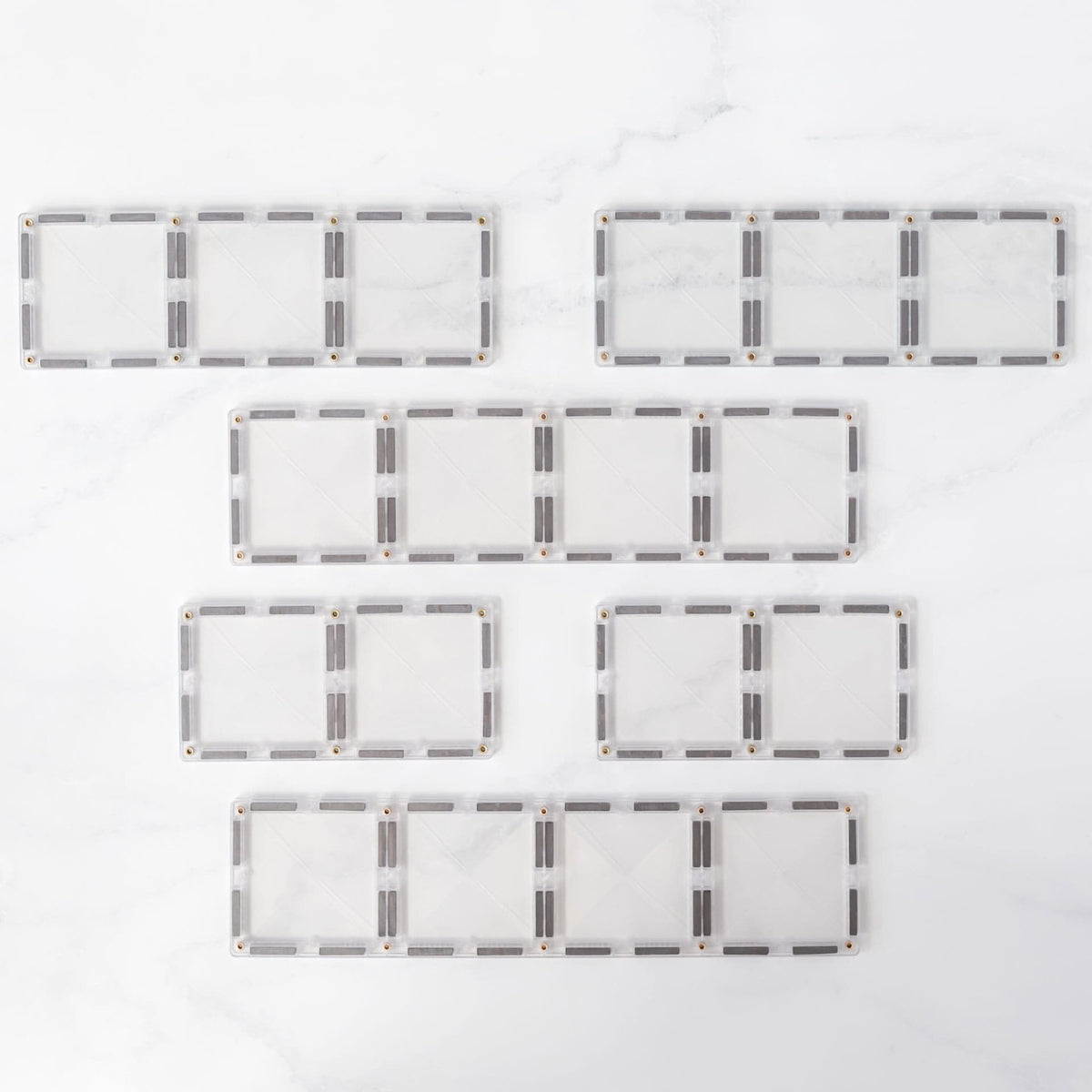 Clear Connetix rectangles in three lengths laid flat