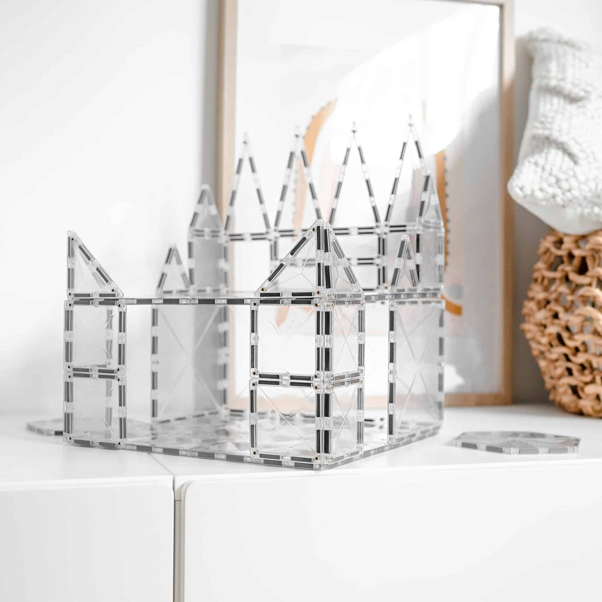 Clear Connetix base plate supporting a tile castle