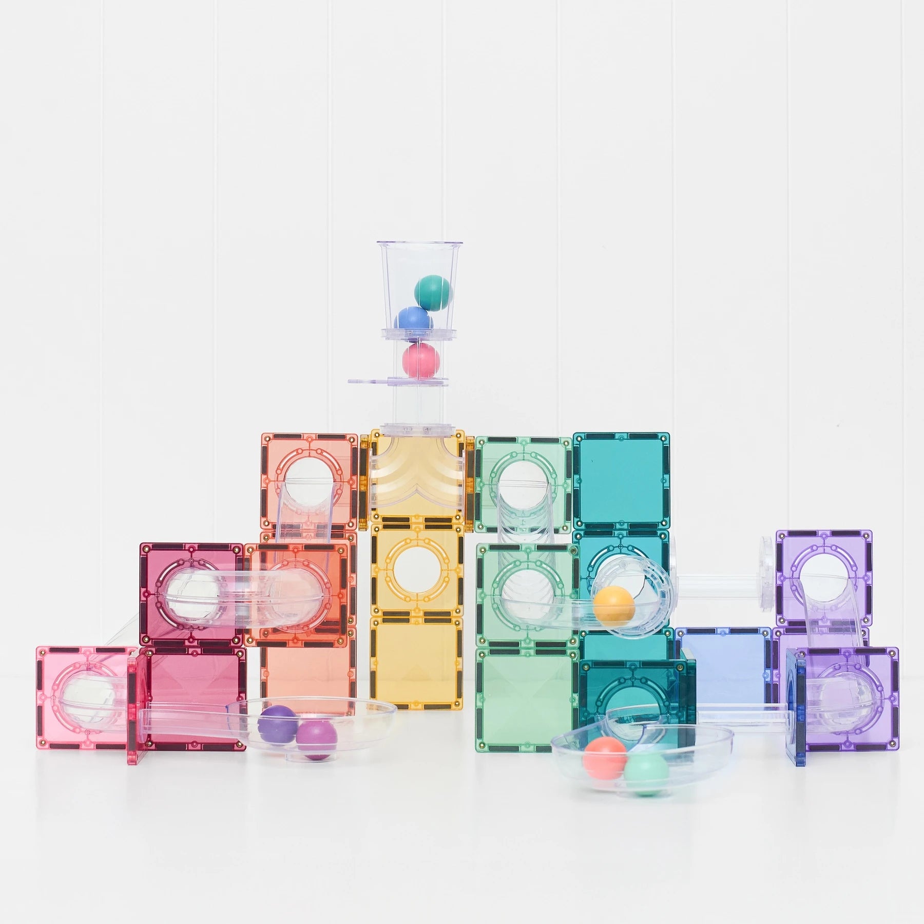 Child playing with the Connetix Pastel 114 Piece Ball Run