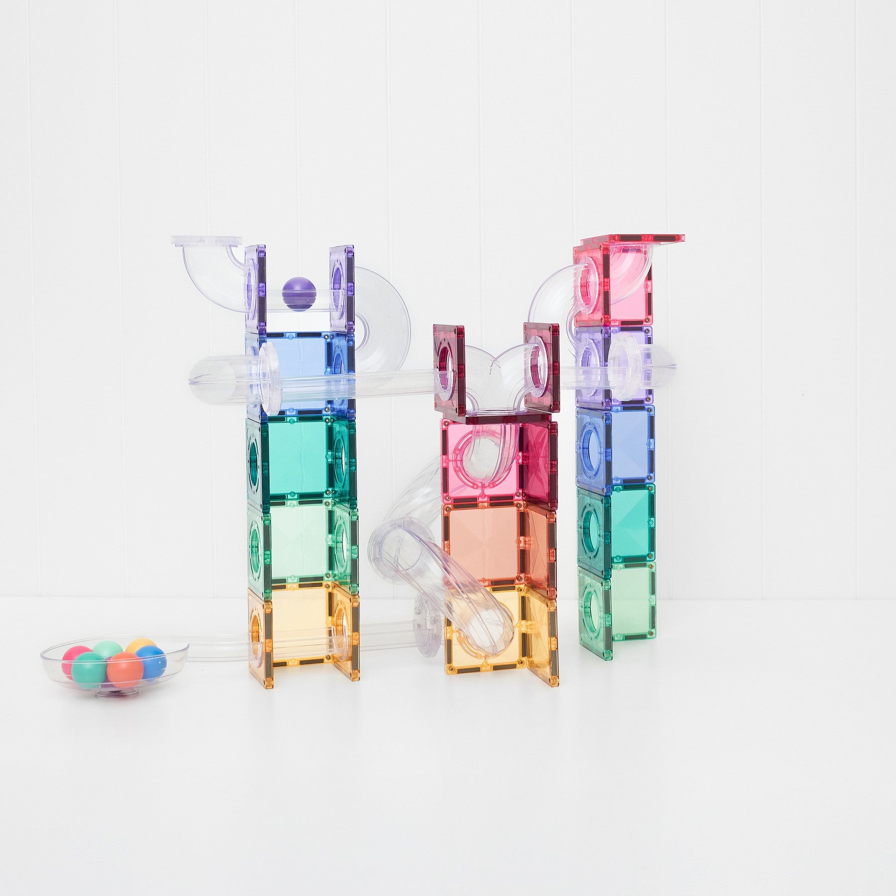 Close up of Connetix pastel connector tiles and clear fluted tubes