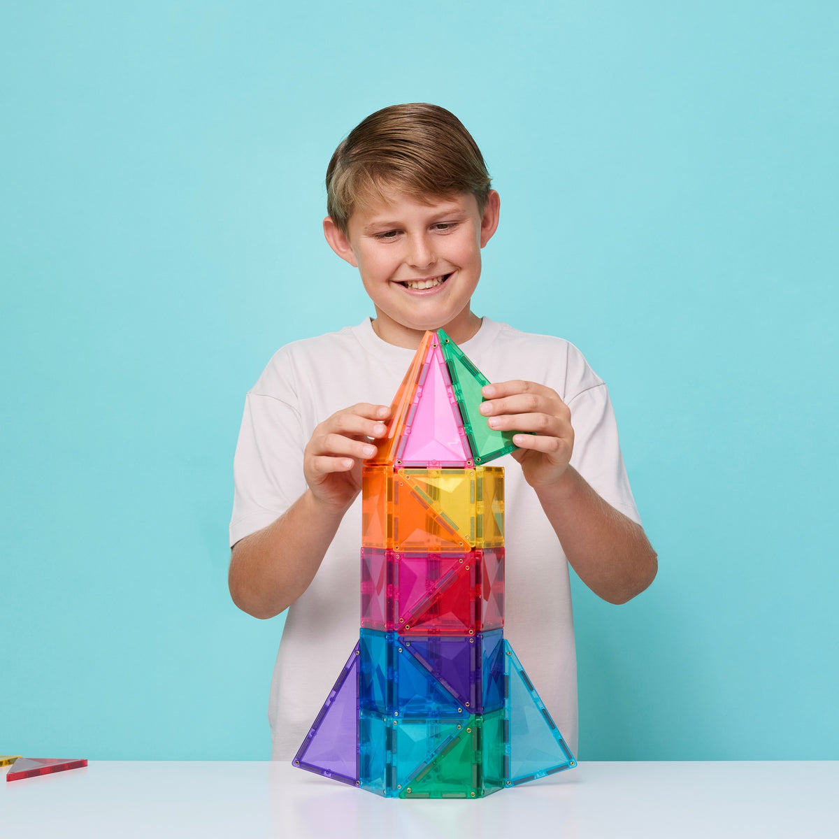 Child building with Connetix Bright Starter 56 Piece Pack