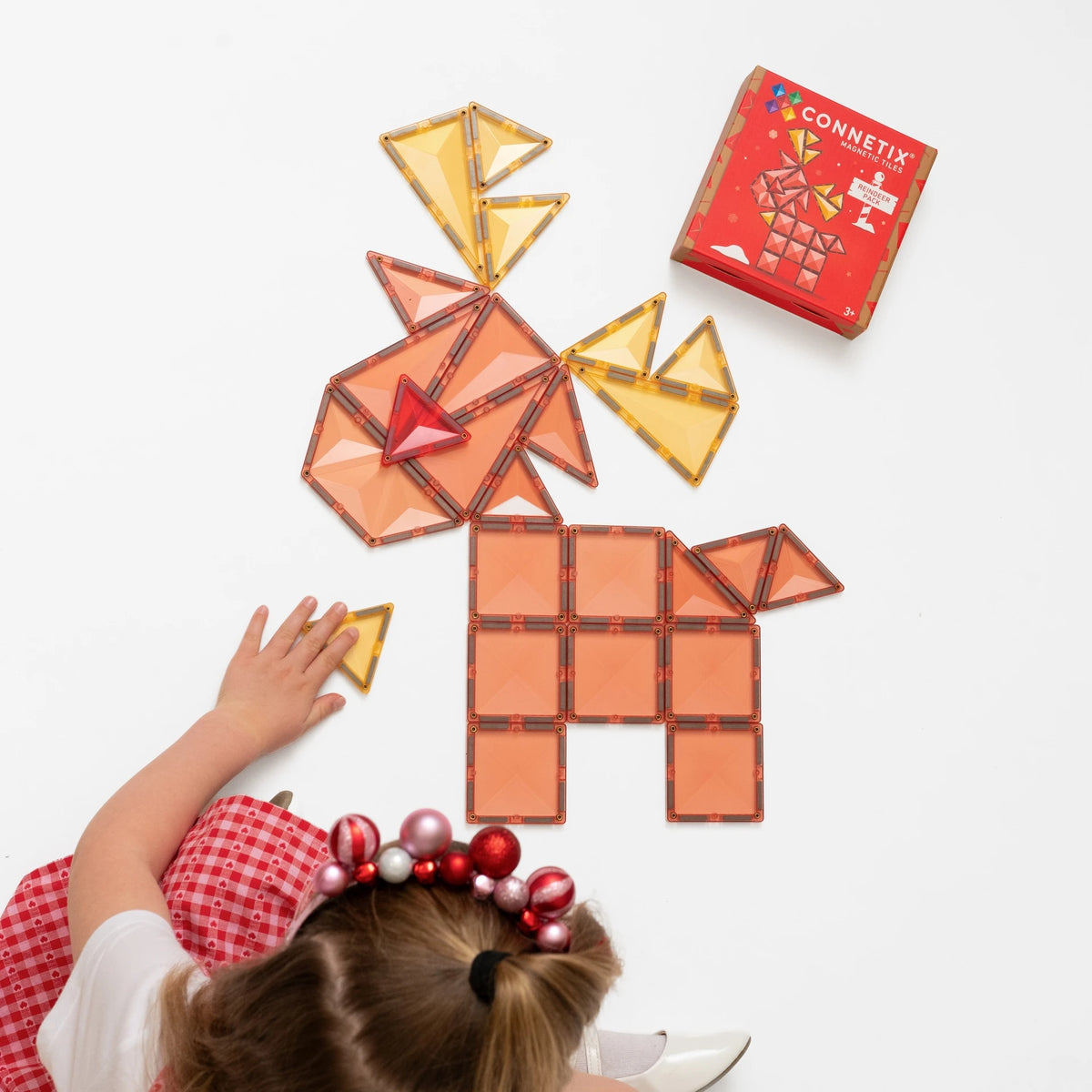 Child building the Connetix Christmas Reindeer magnetic tile pack