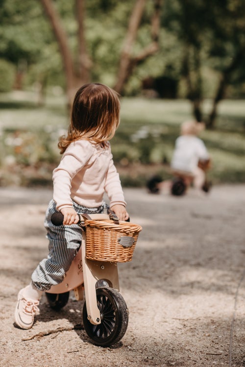 Toddler riding the Kinderfeets Tiny Tot Plus