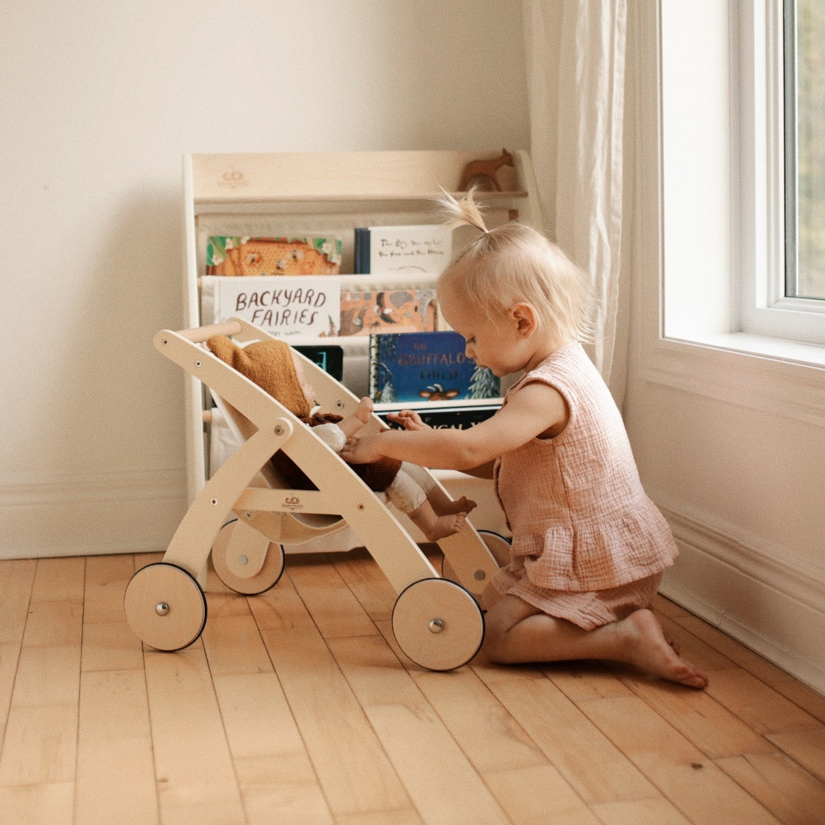 Child playing with the Kinderfeets Doll Stroller