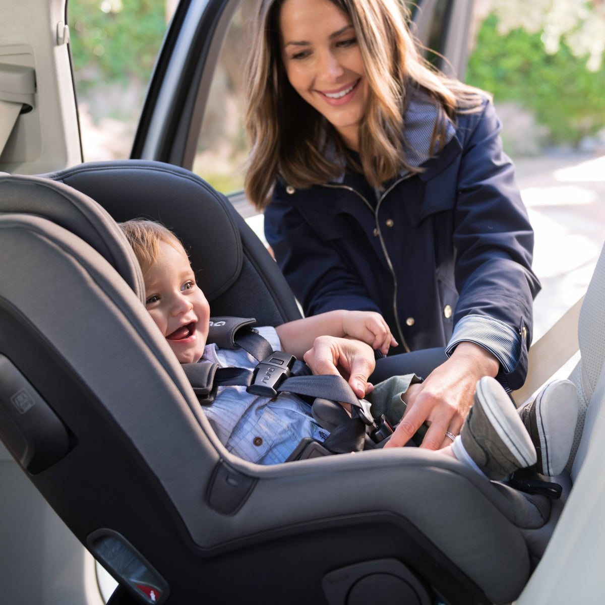 Nuna RAVA car seat in Caviar installed in a vehicle
