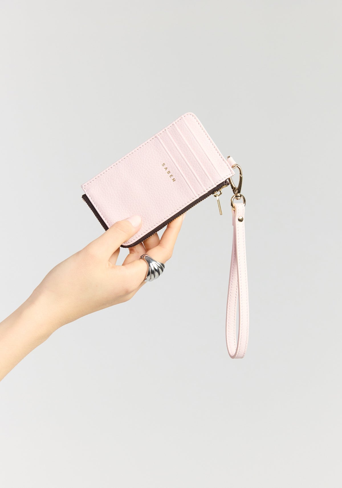 saben winona card holder wristlet ambrosia held in hand