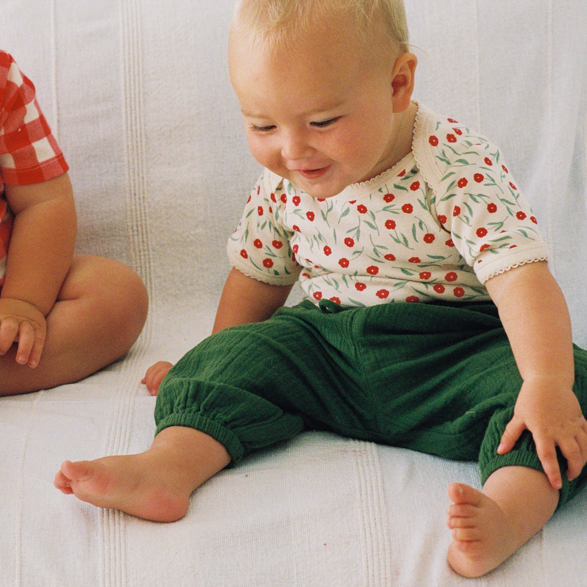 Short Sleeve Bodysuit in Joiette Print worn by baby