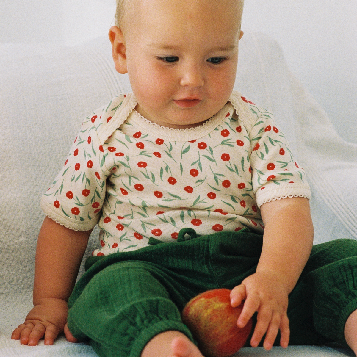 Short Sleeve Bodysuit in Joiette Print worn by baby